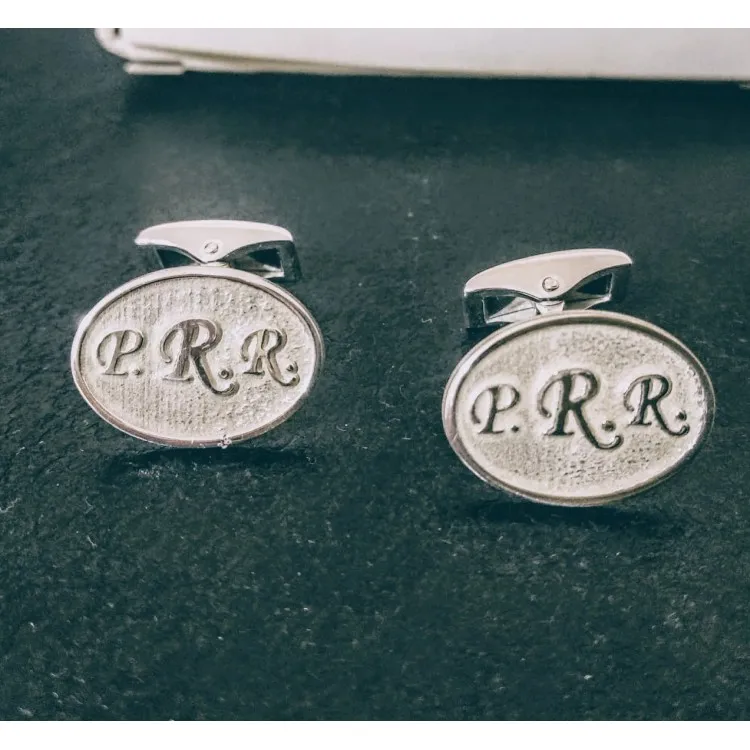 Gemelos ovalados alto relieve plata de ley