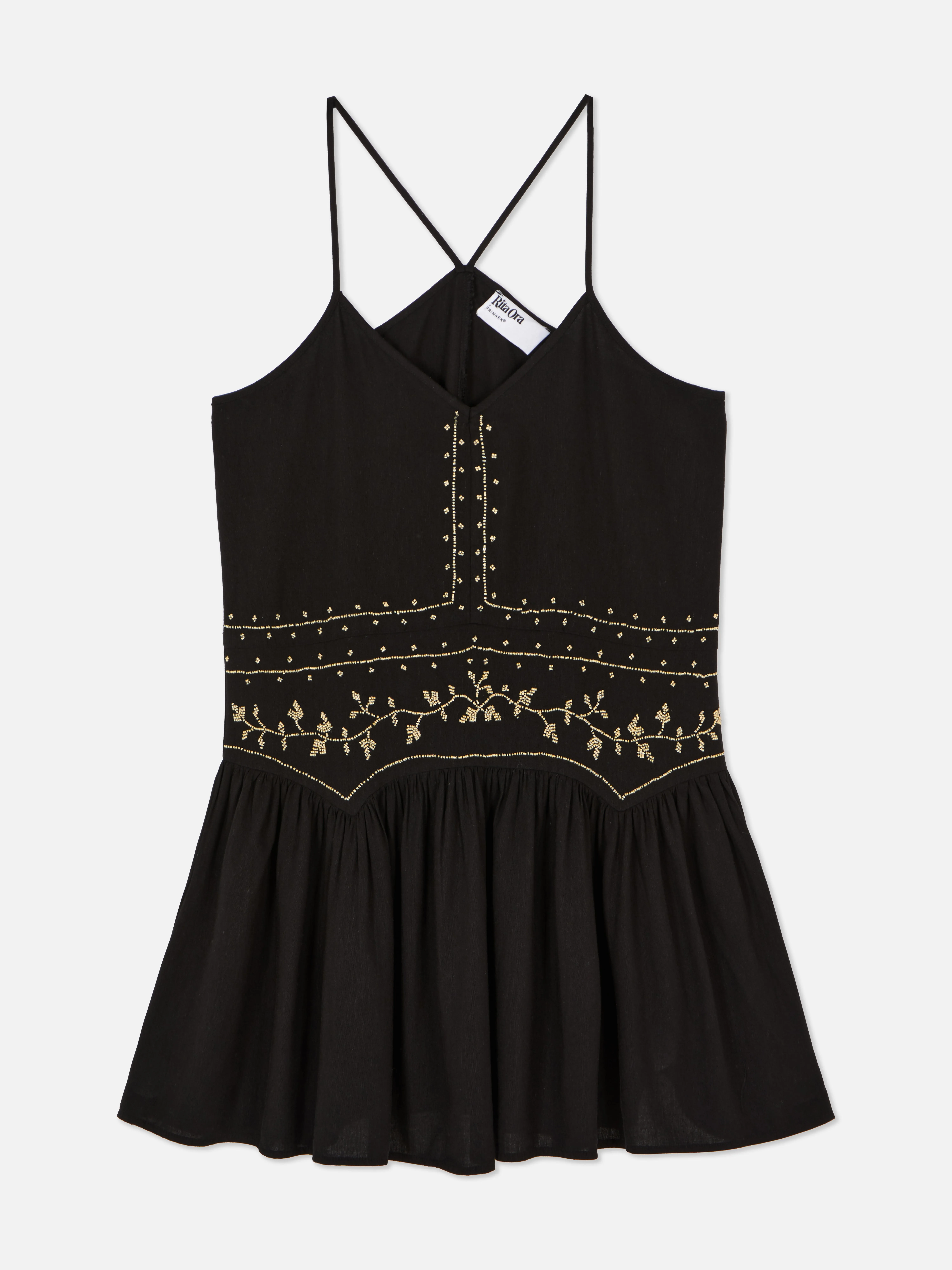 Vestido corto con cuentas de Rita Ora